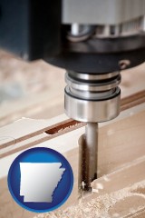 arkansas map icon and a CNC milling machine cutting wood