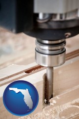 florida map icon and a CNC milling machine cutting wood