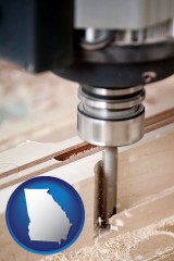 georgia map icon and a CNC milling machine cutting wood