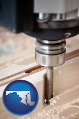 maryland map icon and a CNC milling machine cutting wood