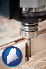 me map icon and a CNC milling machine cutting wood