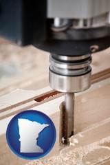 minnesota map icon and a CNC milling machine cutting wood