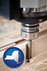 new-york map icon and a CNC milling machine cutting wood