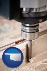 oklahoma map icon and a CNC milling machine cutting wood