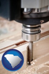 south-carolina map icon and a CNC milling machine cutting wood