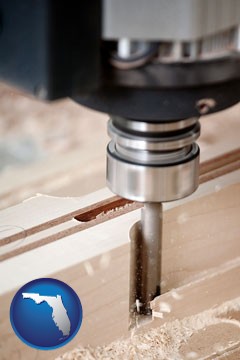 a CNC milling machine cutting wood - with Florida icon