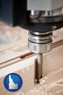a CNC milling machine cutting wood - with Idaho icon