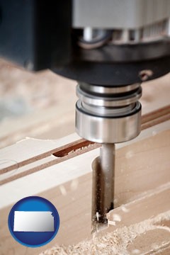a CNC milling machine cutting wood - with Kansas icon