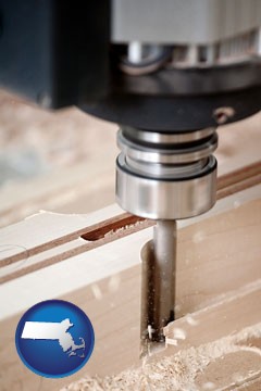 a CNC milling machine cutting wood - with Massachusetts icon