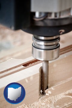 a CNC milling machine cutting wood - with Ohio icon