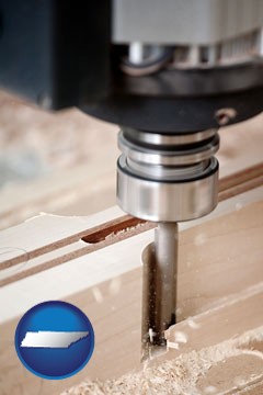 a CNC milling machine cutting wood - with Tennessee icon