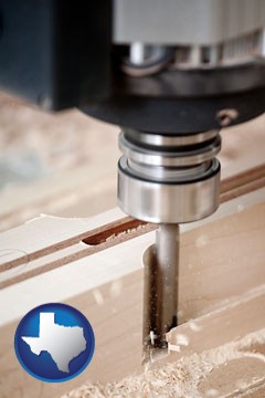 a CNC milling machine cutting wood - with Texas icon