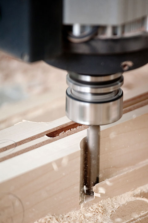 a CNC milling machine cutting wood